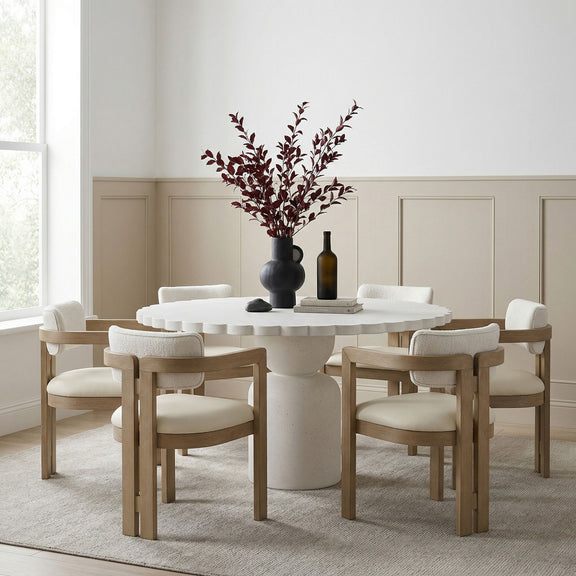 Indoor/outdoor table with round white top and light wood pedestal base
