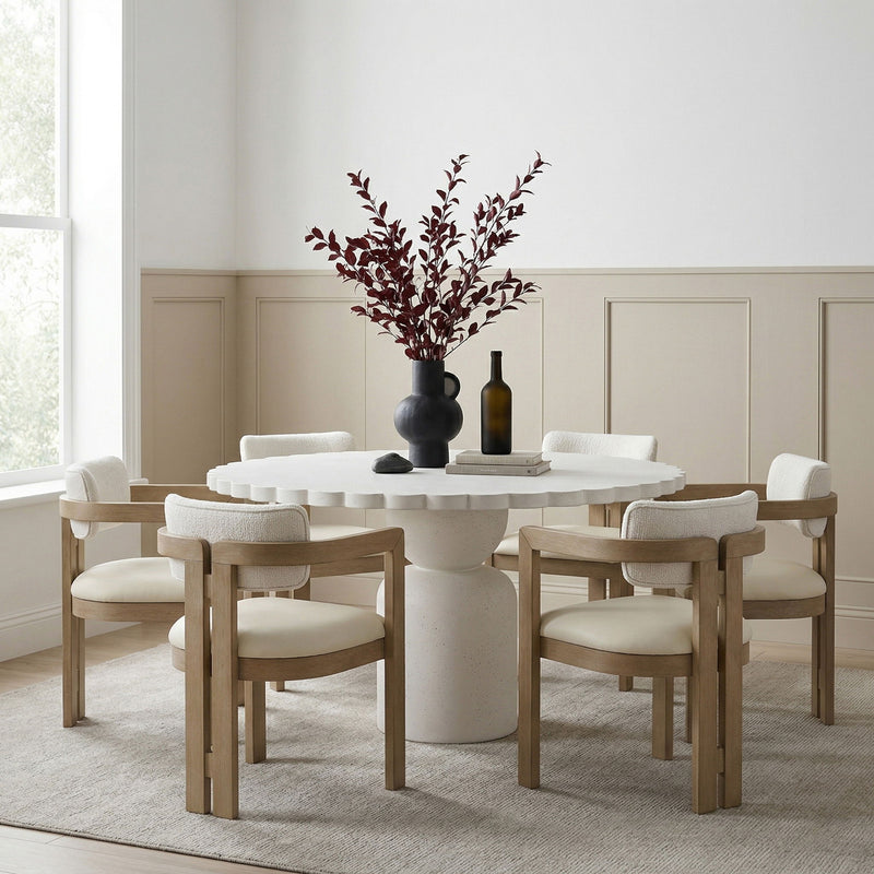 Indoor/outdoor table with round white top and light wood pedestal base