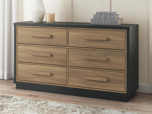 Black frame six-drawer dresser with light brown wood drawers and bar pulls