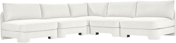 White velvet armless sectional sofa with modular L-shape and padded back cushions