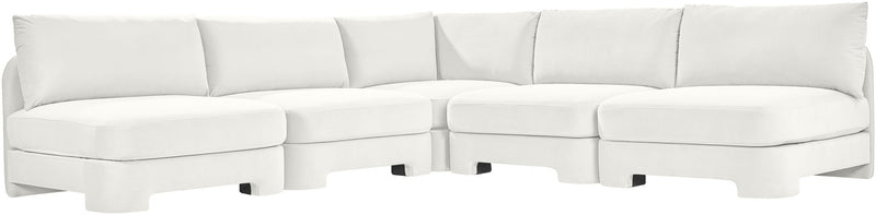 White velvet armless sectional sofa with modular L-shape and padded back cushions