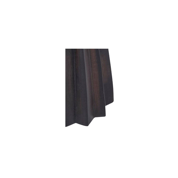 Sculpted dark brown wood base of a table lamp, side view