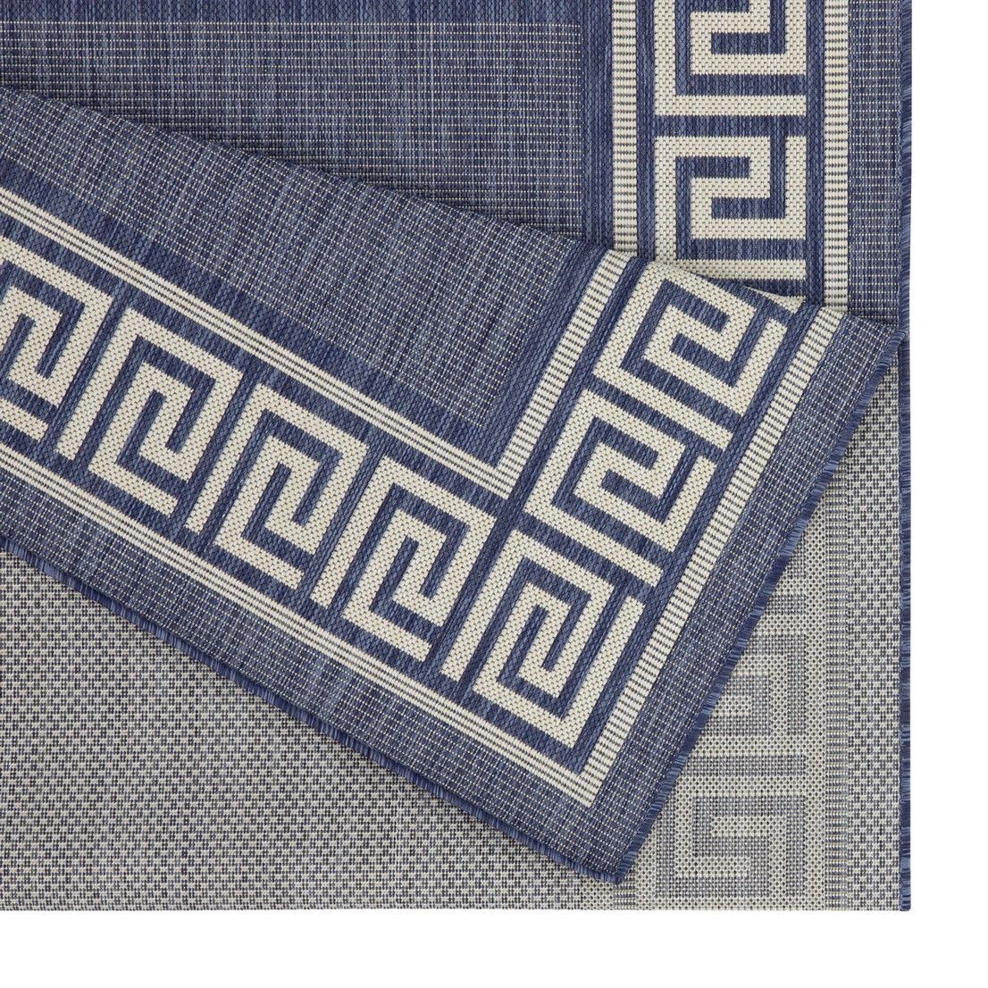Blue polypropylene area rug corner detail with Greek key border and diamond texture