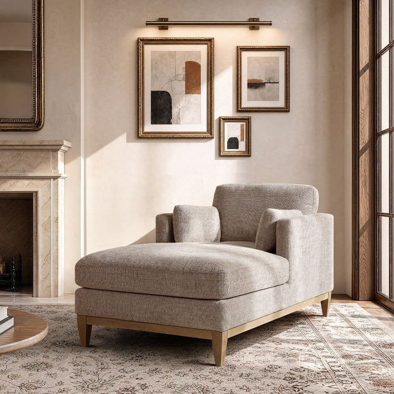 Upholstered chaise lounge chair with gray fabric, ottoman-style seat, and wooden legs