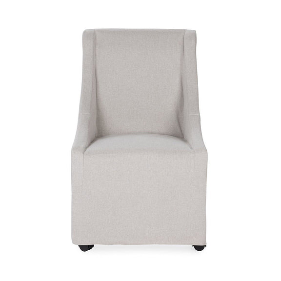 Upholstered rolling dining chair in pale gray fabric, tall back and padded armrests
