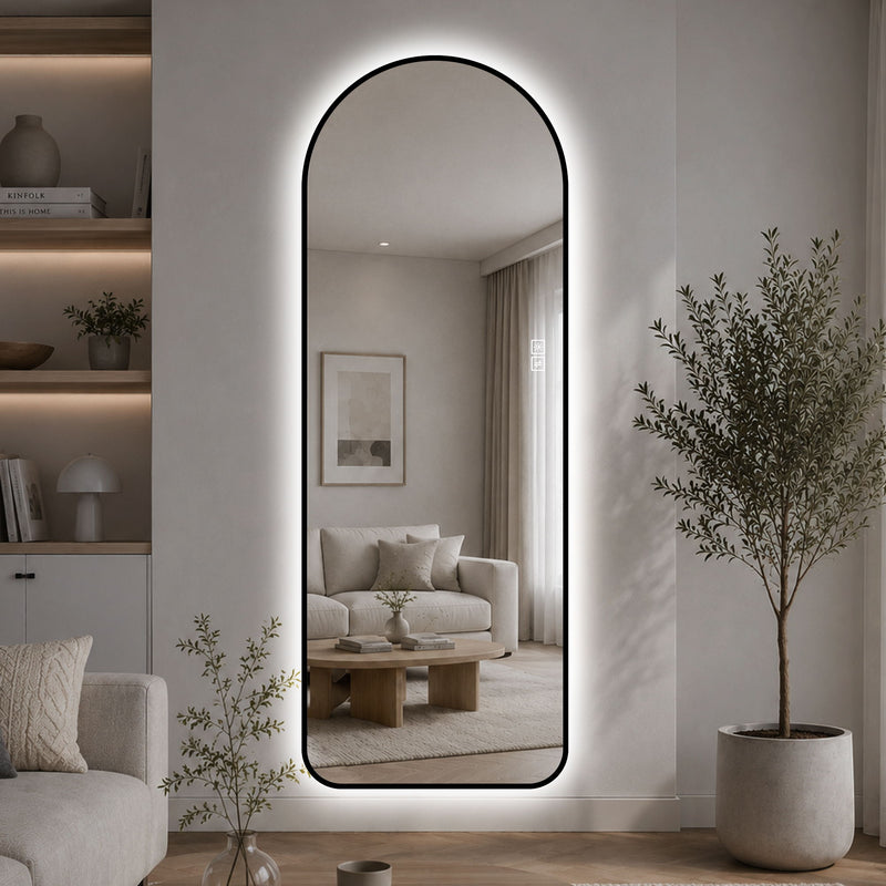 Arched full-length LED mirror with black frame and glowing border, in living room