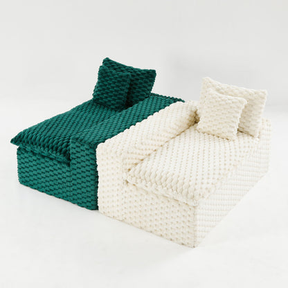 Two-tone chunky knit sofa with dark green seating and white armrest cushions