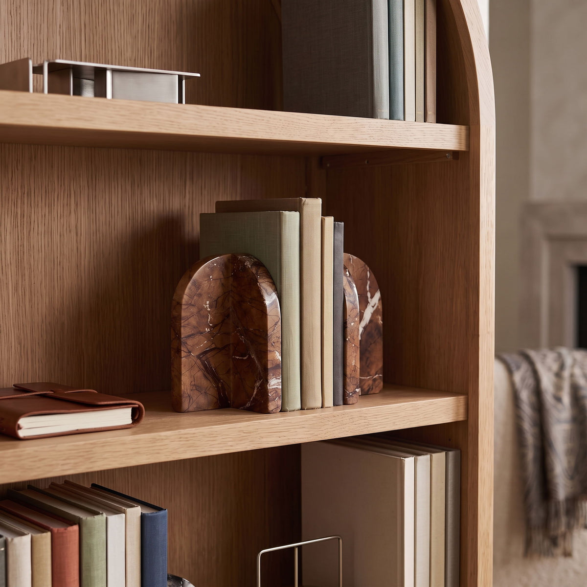 Genuine marble bookends in dark brown with reddish tones and marbled veining.