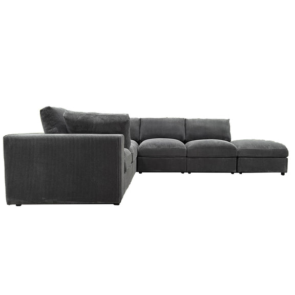 Reversible modular sectional sofa in dark gray, left chaise with cushioned ottoman blocks