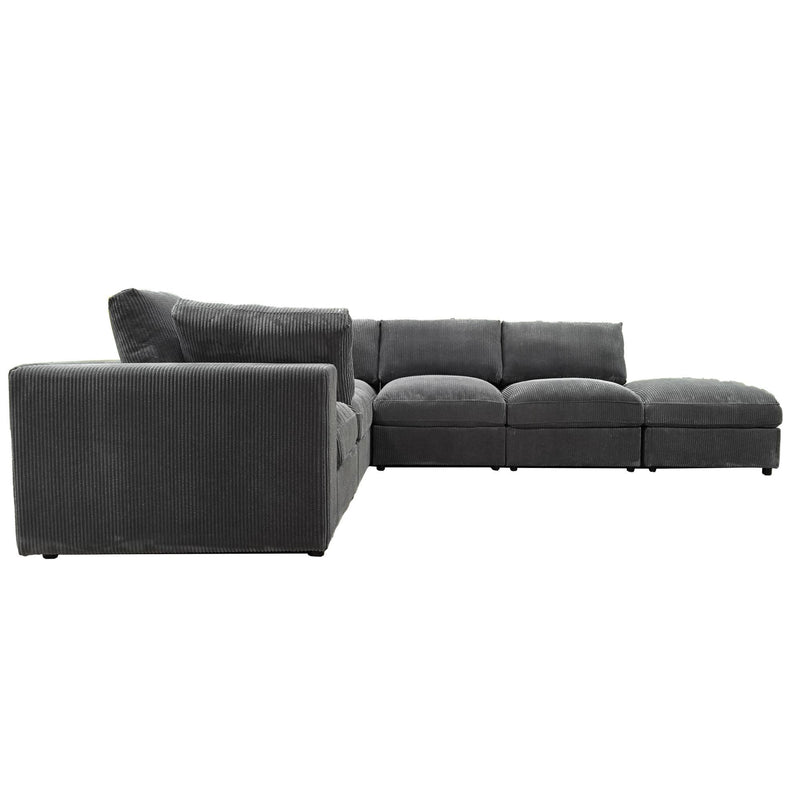 Reversible modular sectional sofa in dark gray, left chaise with cushioned ottoman blocks