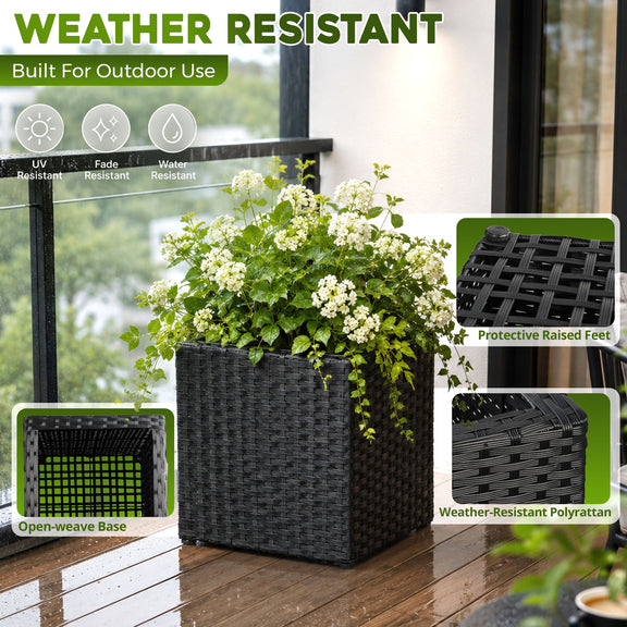 Black woven planter with raised feet and open-weave base, shown planted outdoors.