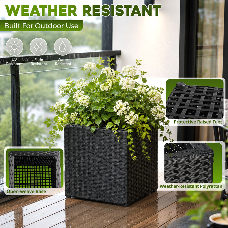 Black woven planter with raised feet and open-weave base, shown planted outdoors.