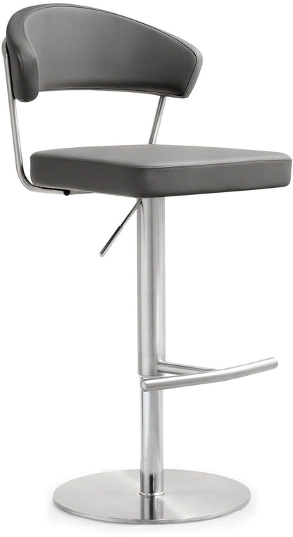 Dark gray upholstered barstool with curved back and footrest bar on pedestal