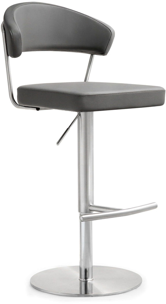 Dark gray upholstered barstool with curved back and footrest bar on pedestal