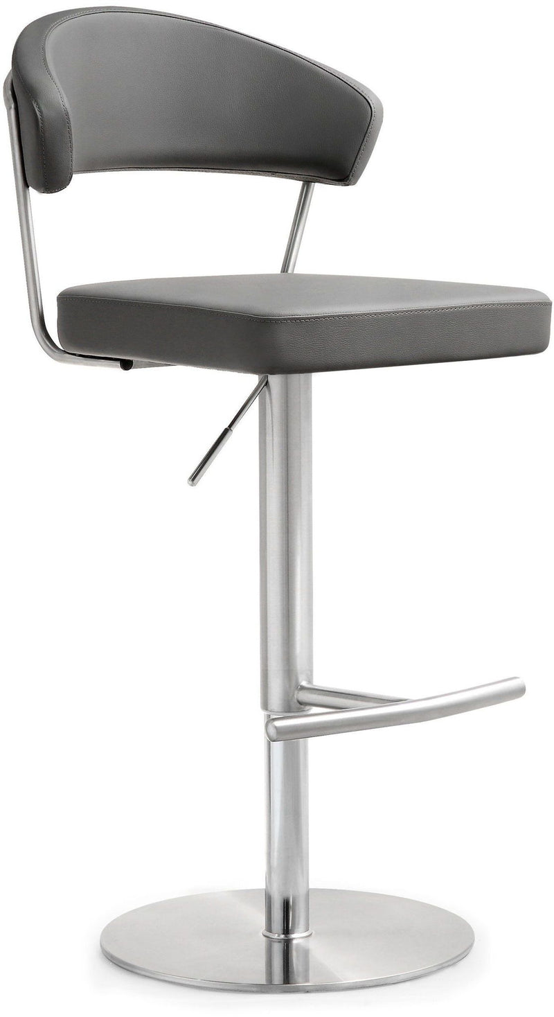 Dark gray upholstered barstool with curved back and footrest bar on pedestal