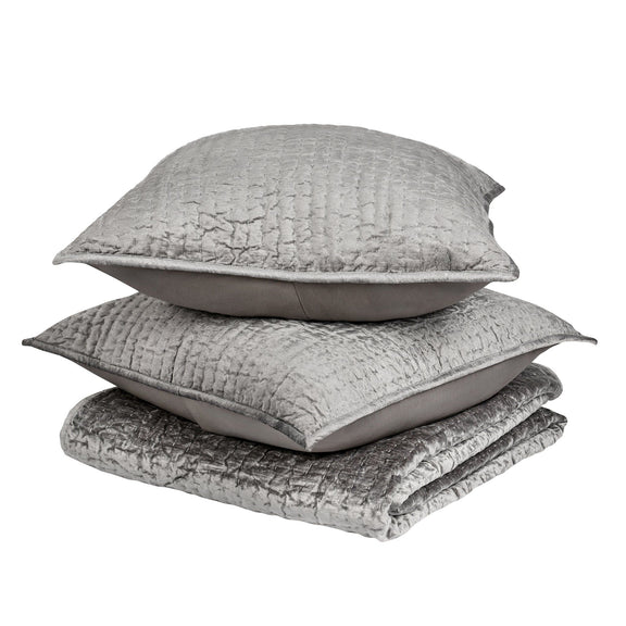 Light gray velvet quilt set with coordinating shams and pillows
