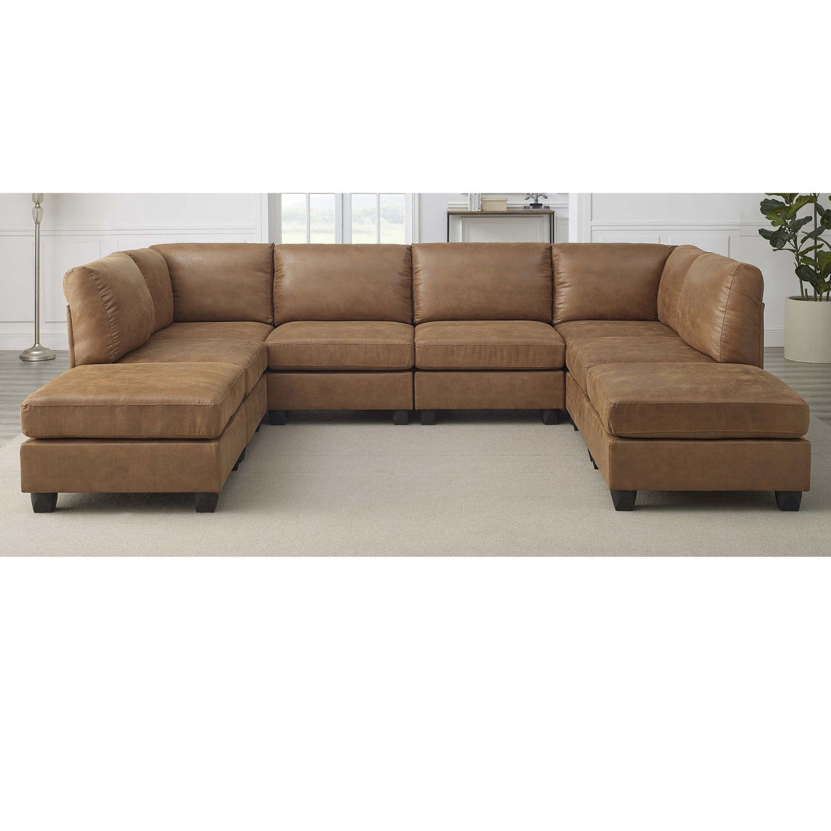 Brown modular sectional sofa with padded armrests and corner chaise ottomans