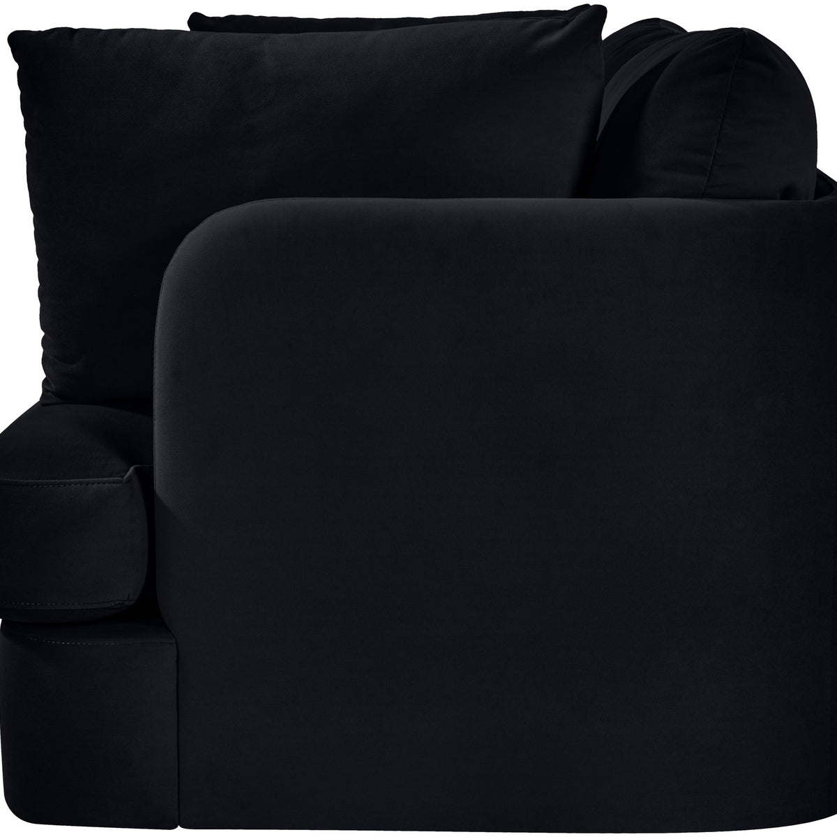 Black velvet upholstered loveseat with rolled arms, plush back cushions, chaise-style seat