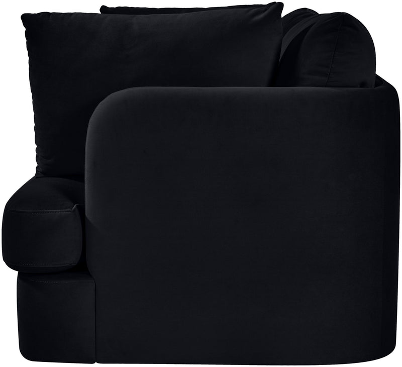 Black velvet upholstered loveseat with rolled arms, plush back cushions, chaise-style seat