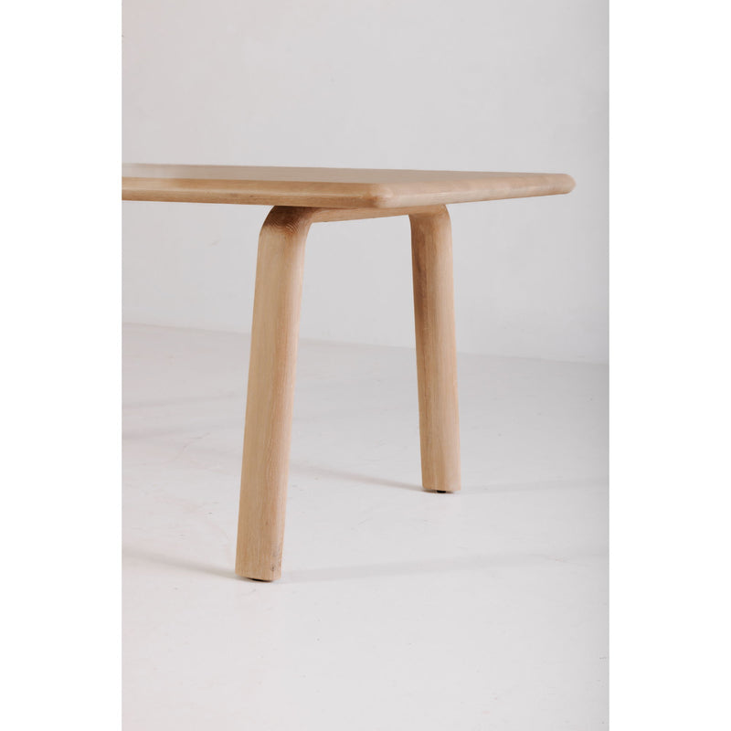 White oak dining table corner detail with rounded leg and smooth edge apron