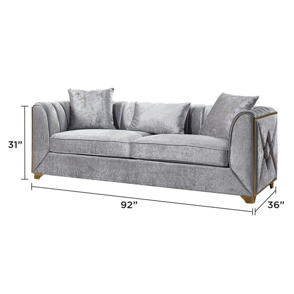 Gray fabric sofa with rolled arms and textured accent pillows