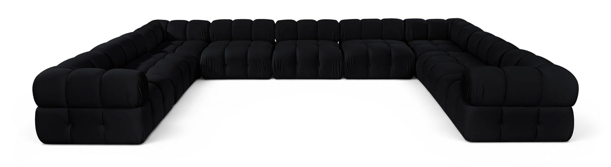 Black velvet upholstered sectional sofa with tufted cushions and rounded corner arms