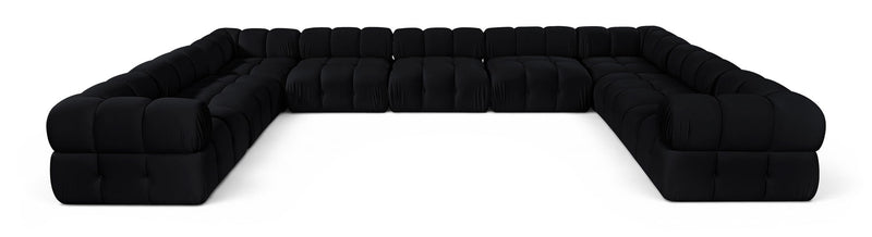 Black velvet upholstered sectional sofa with tufted cushions and rounded corner arms