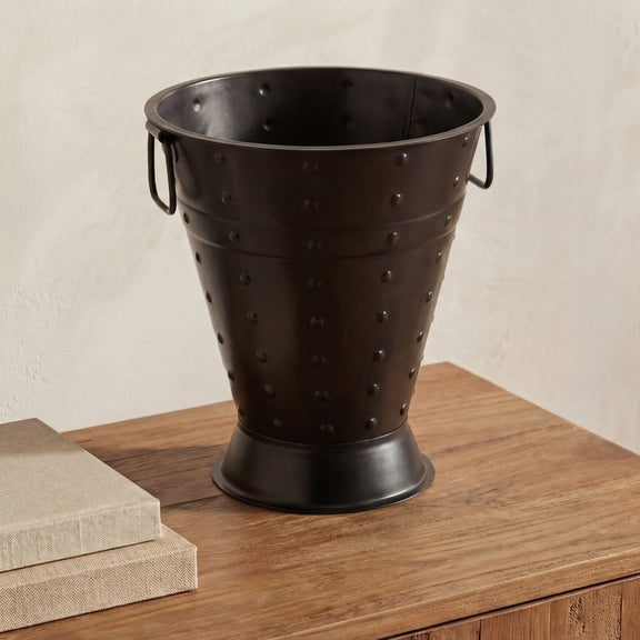Black metal vase with studded texture and two side handles