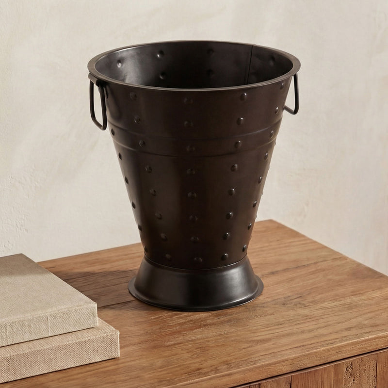 Black metal vase with studded texture and two side handles