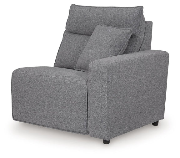 Salt-and-pepper gray upholstered recliner with reclined back, lumbar pillows, and track arms