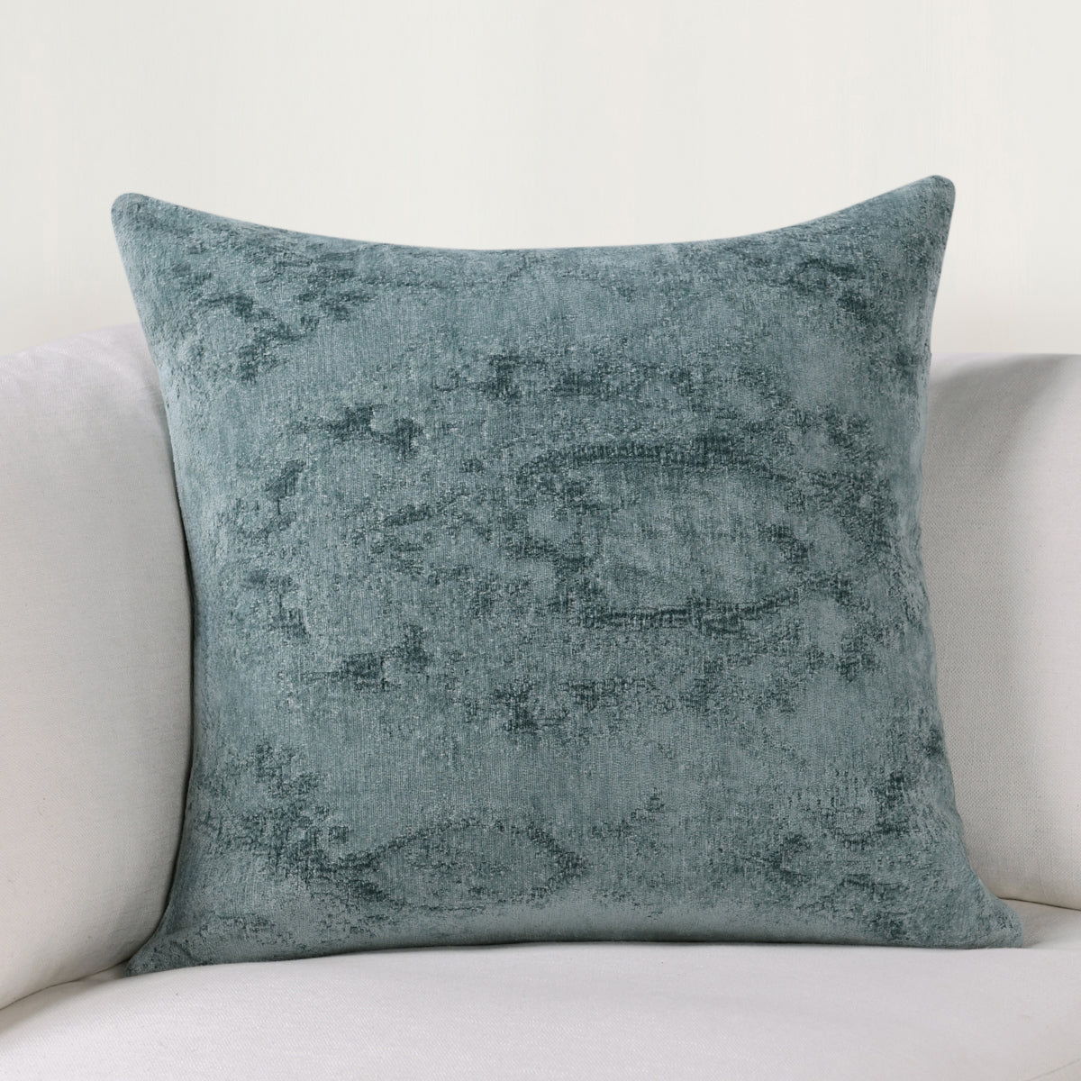 SLD decorative pillow in muted blue with distressed texture, square front