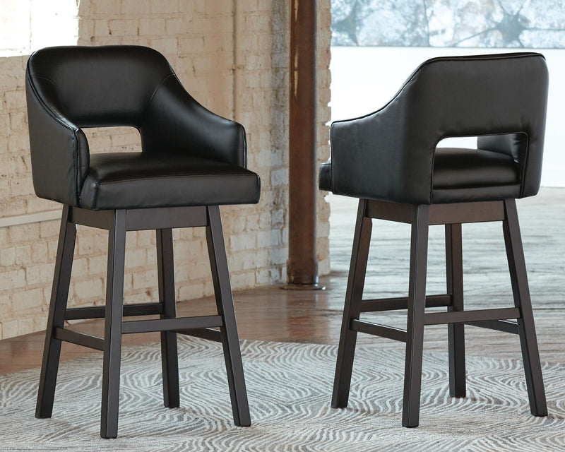 Two black upholstered swivel barstools, padded arms, sturdy straight legs