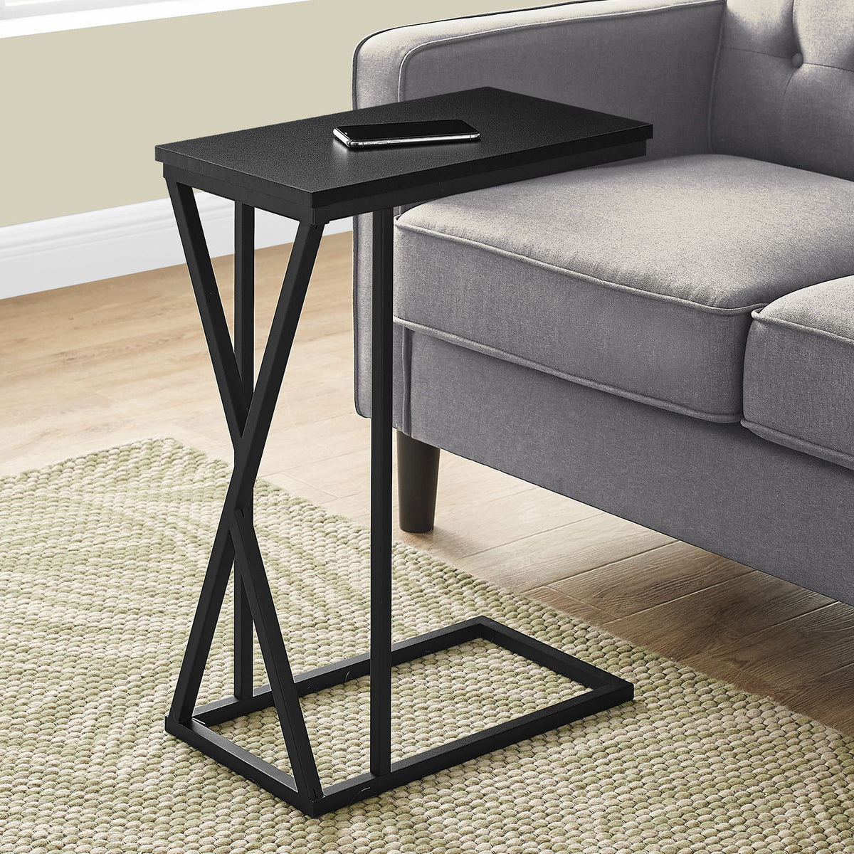 Square-topped accent table with black metal frame and lower shelf, contemporary style
