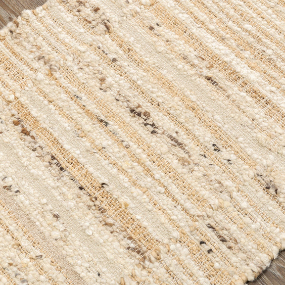 Close-up of natural area rug weave with speckled tan flecks and horizontal lines