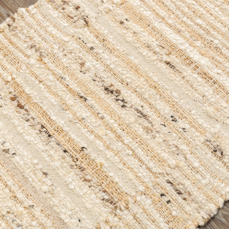 Close-up of natural area rug weave with speckled tan flecks and horizontal lines