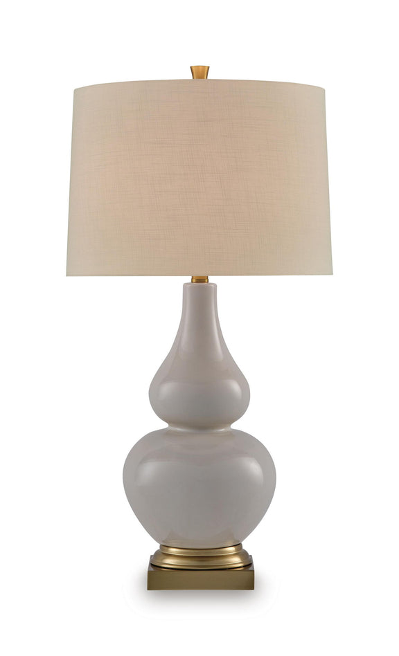 Ceramic table lamp with cream fabric shade, gray body, and gold base