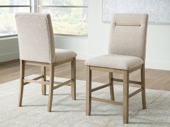 Upholstered barstool set of 2 with beige seats, light brown legs, and gold accent bar