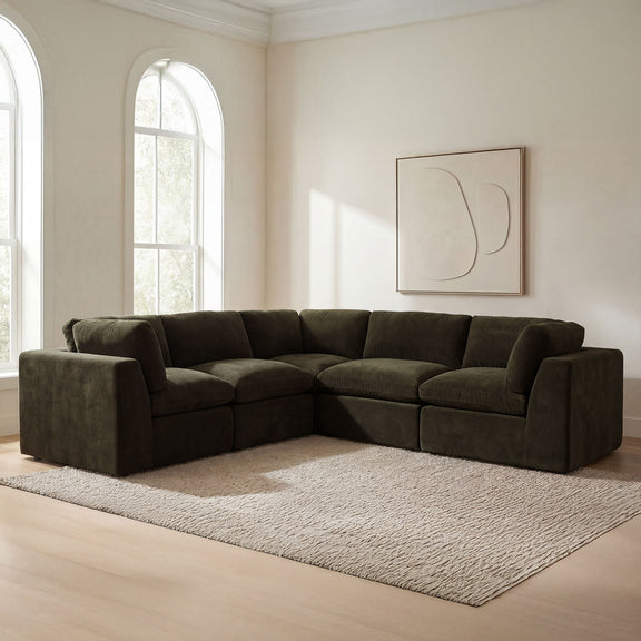 Dark green fabric corner sectional sofa with rounded ends and deep seat cushions