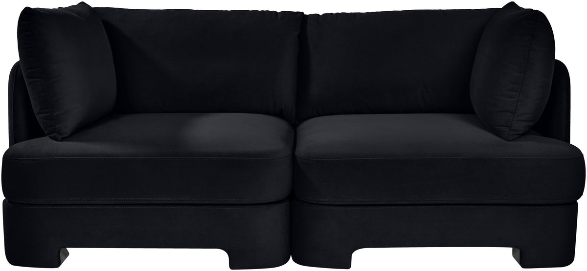 Black velvet upholstered loveseat with two-seat base and padded back cushions
