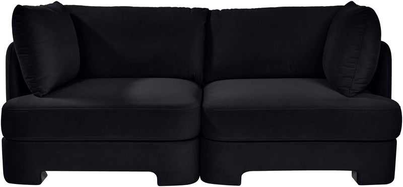 Black velvet upholstered loveseat with two-seat base and padded back cushions