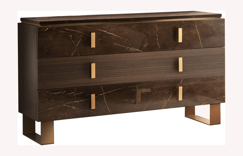 Dark brown dresser front with four drawers, brass bar pulls, and gold legs.