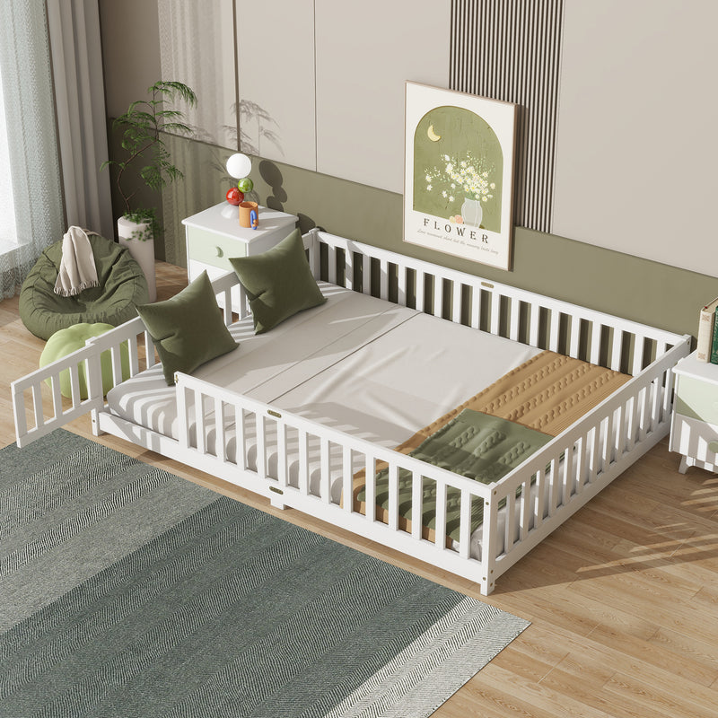 Queen size white floor bed with safety guardrails and slatted fence sides