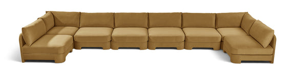 Tan armless U-shaped sectional sofa with chaise modules and box cushions