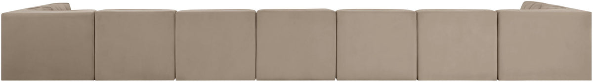 Beige modular sectional sofa with multiple seat cushions and tufted back panels
