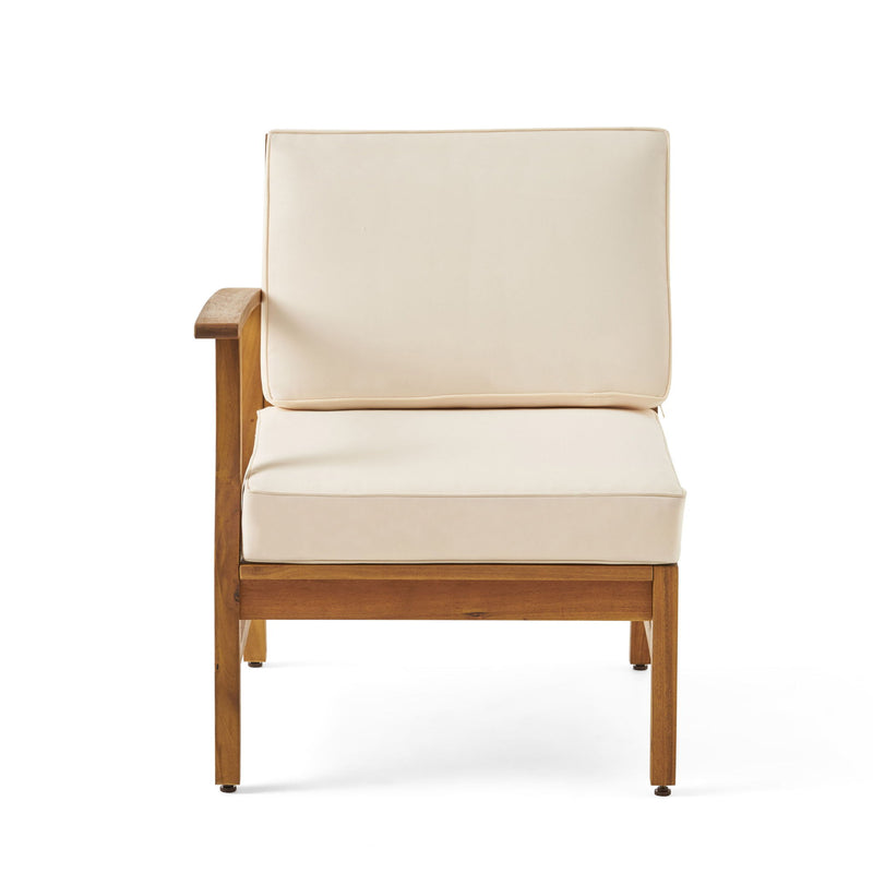 Beige upholstered sofa chair with wooden arms and legs.