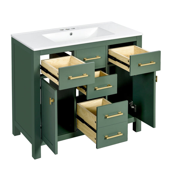 Dark green bathroom vanity with sink, four open drawers, two open doors, and gold-tone pulls