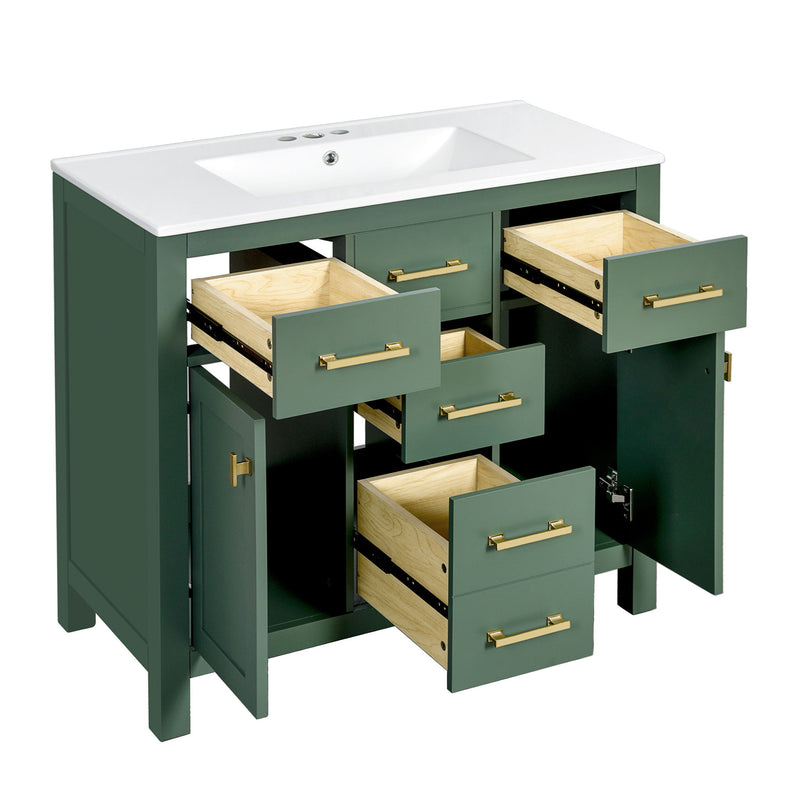 Dark green bathroom vanity with sink, four open drawers, two open doors, and gold-tone pulls