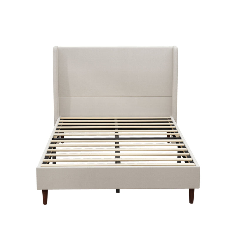 Beige upholstered bed with tall headboard, wooden slats, and tapered legs