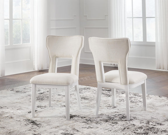 Set of 2 upholstered dining side chairs, white frame, light beige seats and backs