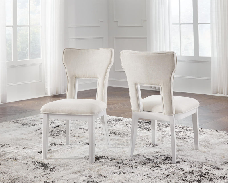 Set of 2 upholstered dining side chairs, white frame, light beige seats and backs